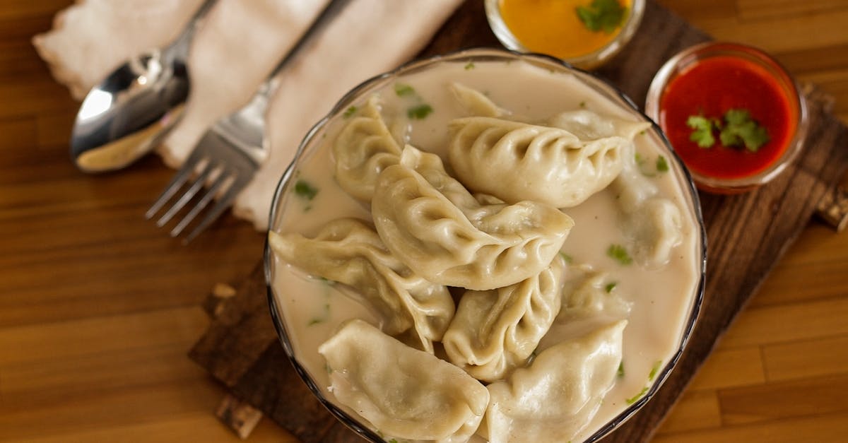 Nepalese Jhol Momo served in savory broth with vibrant sauces. A culinary treat from Itahari.
